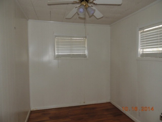 2646 Powersville Road Byron, GA 31008 - Photo 6 of 8 a view of a room with wooden floor and fan