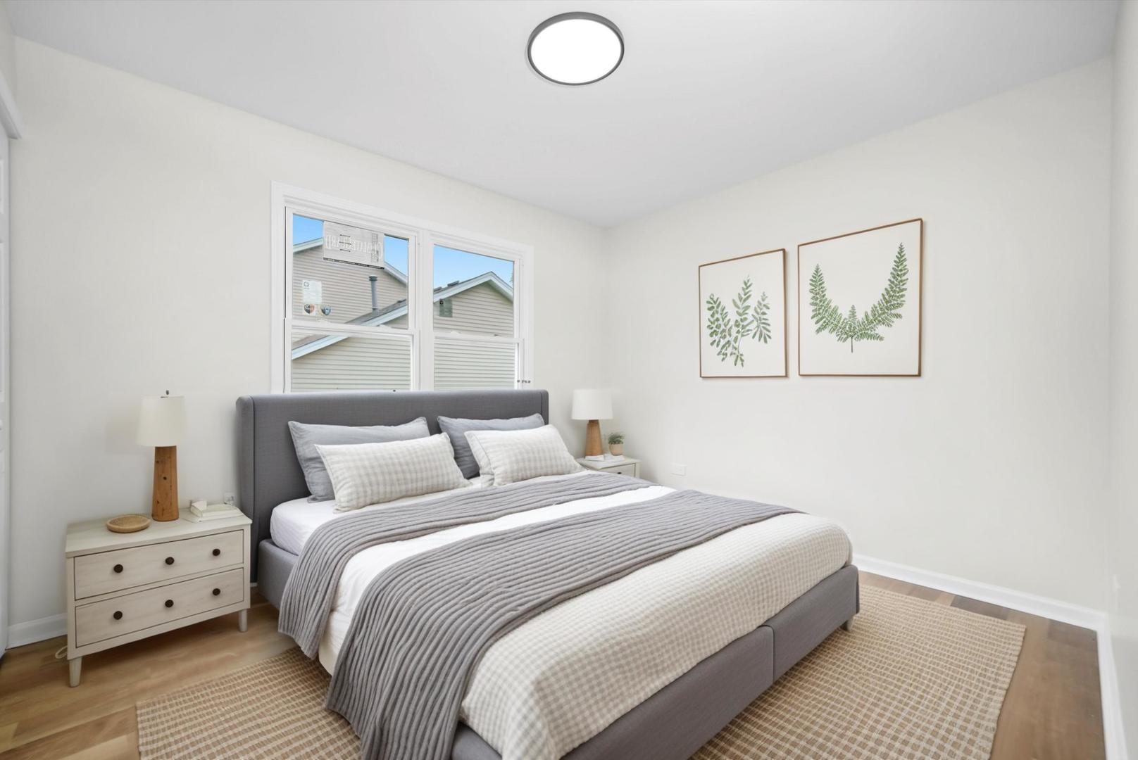 1668 Hidden Valley Drive Bolingbrook, IL 60490 - Photo 14 of 43 a bedroom with a bed and a painting on the wall