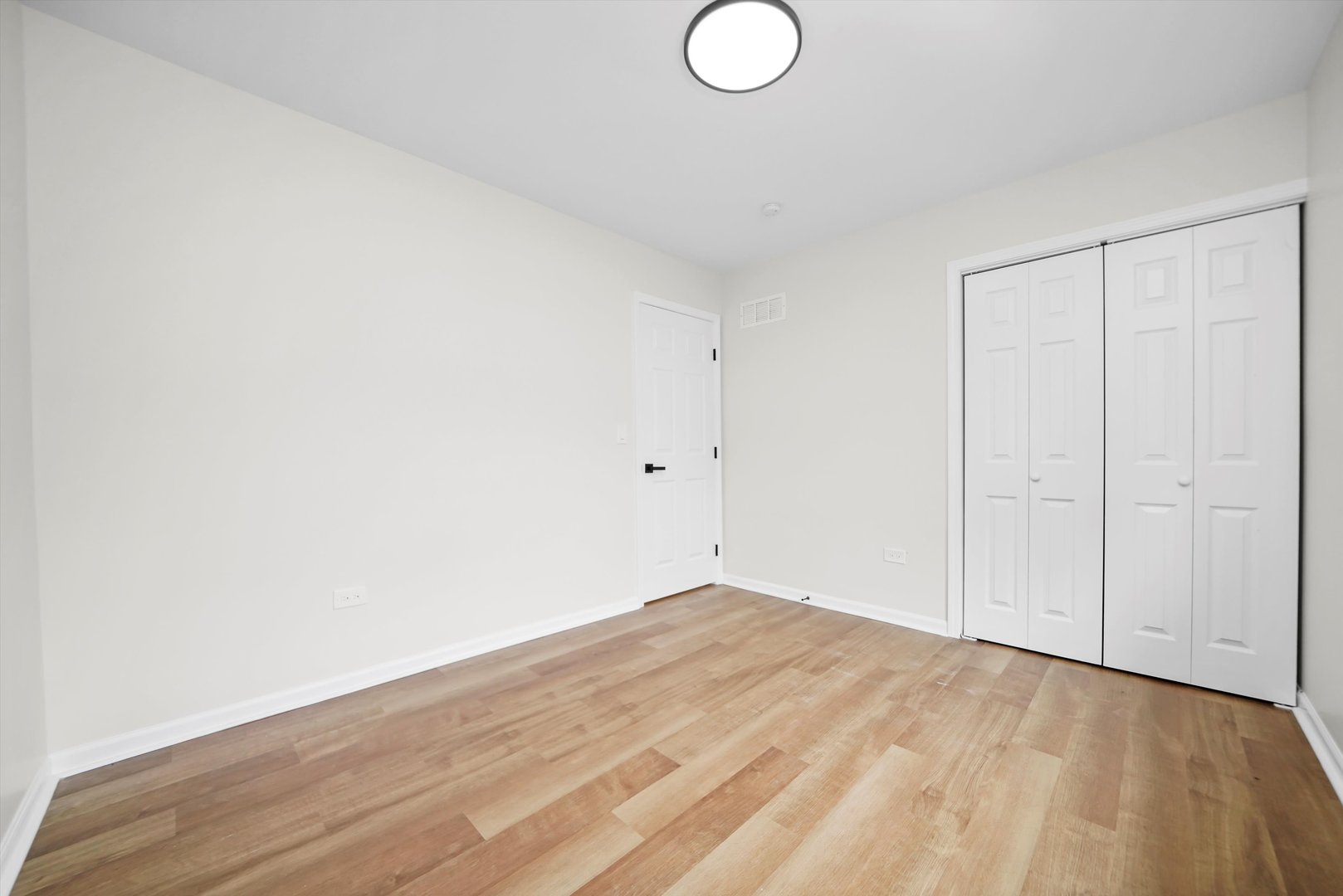 1668 Hidden Valley Drive Bolingbrook, IL 60490 - Photo 16 of 43 a view of empty room with wooden floor