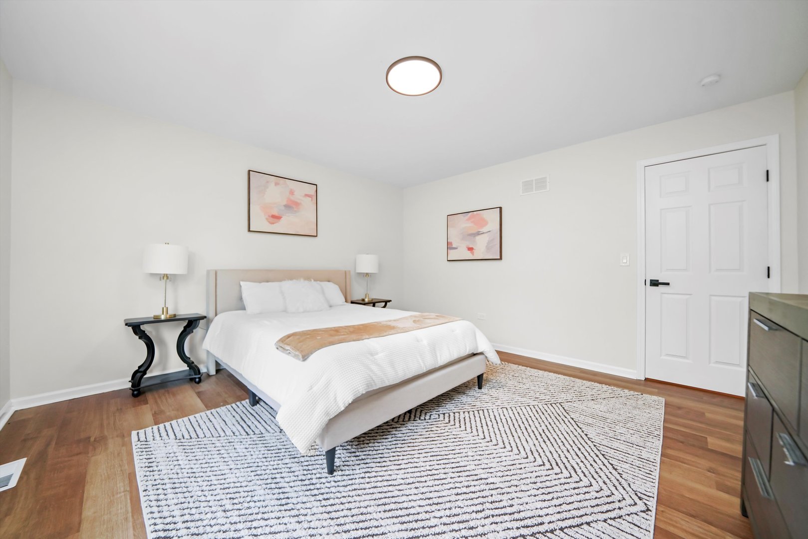 1668 Hidden Valley Drive Bolingbrook, IL 60490 - Photo 23 of 43 a bedroom with a bed and a wooden floor