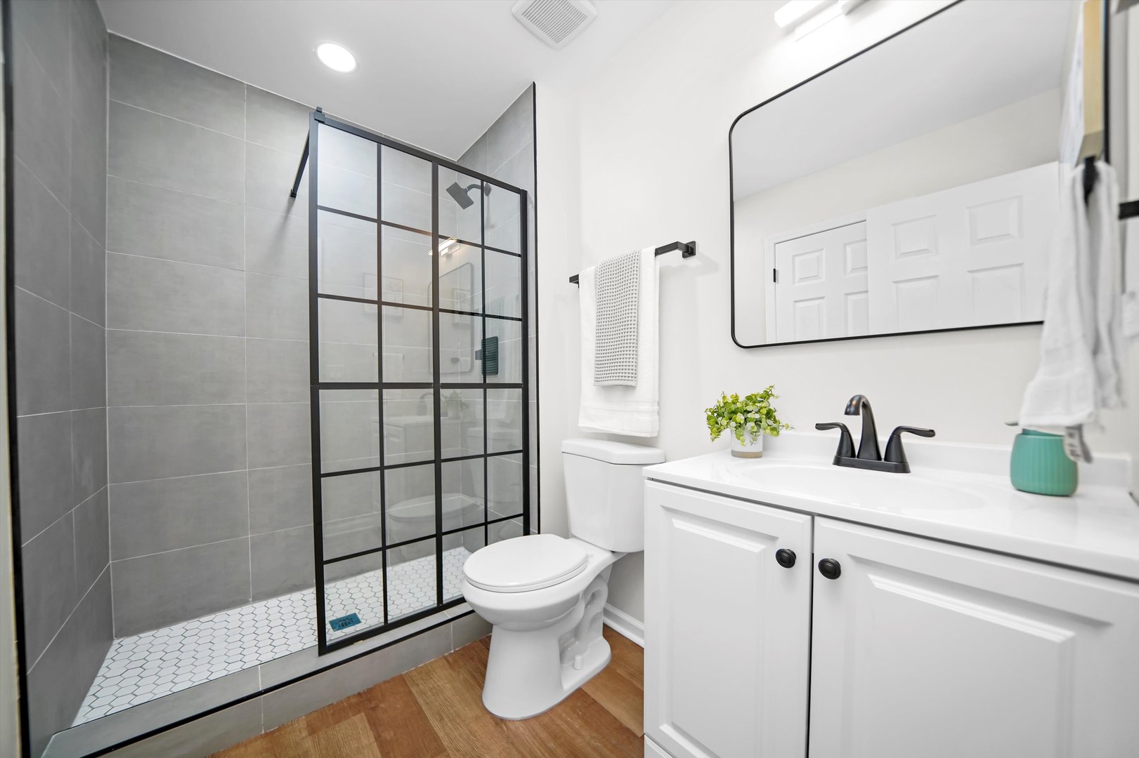 1668 Hidden Valley Drive Bolingbrook, IL 60490 - Photo 26 of 43 a bathroom with a sink toilet and shower