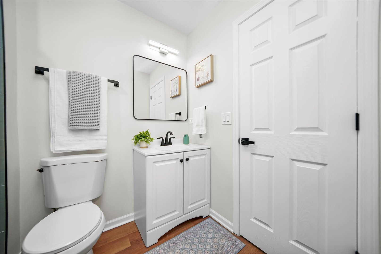 1668 Hidden Valley Drive Bolingbrook, IL 60490 - Photo 27 of 43 a white toilet sitting next to a bathroom sink