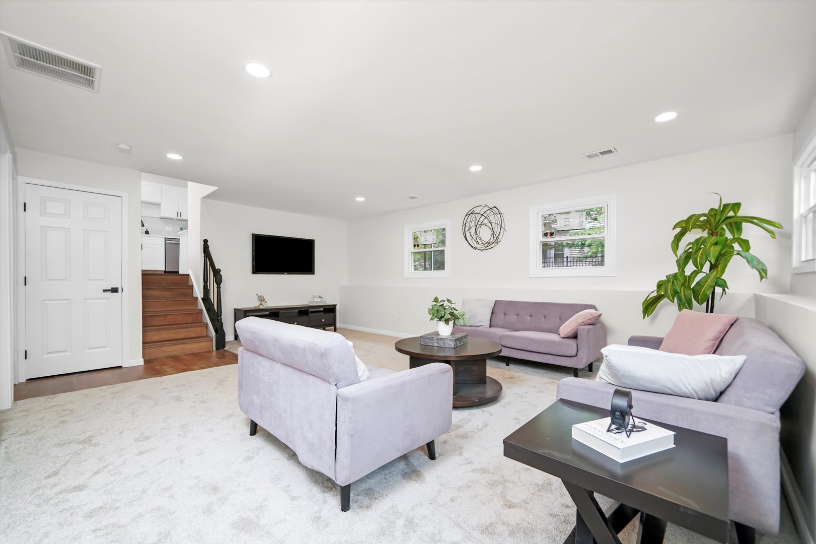 1668 Hidden Valley Drive Bolingbrook, IL 60490 - Photo 28 of 43 a living room with furniture and a flat screen tv