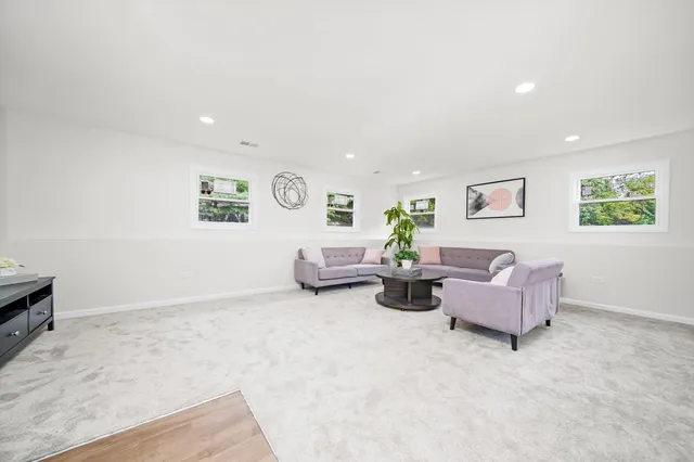 a view of a dining room with furniture and window