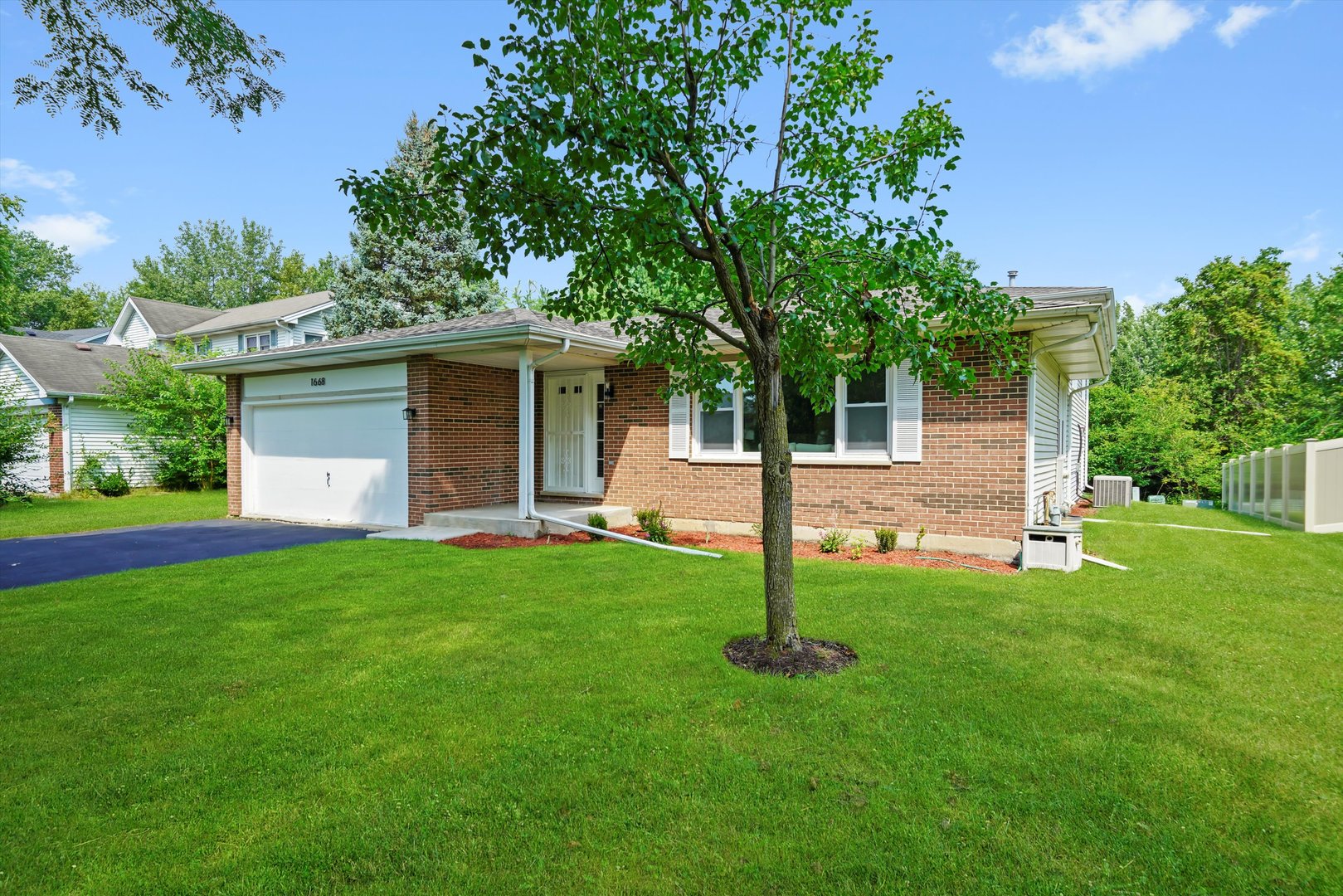 1668 Hidden Valley Drive Bolingbrook, IL 60490 - Photo 4 of 43 a front view of house with a garden