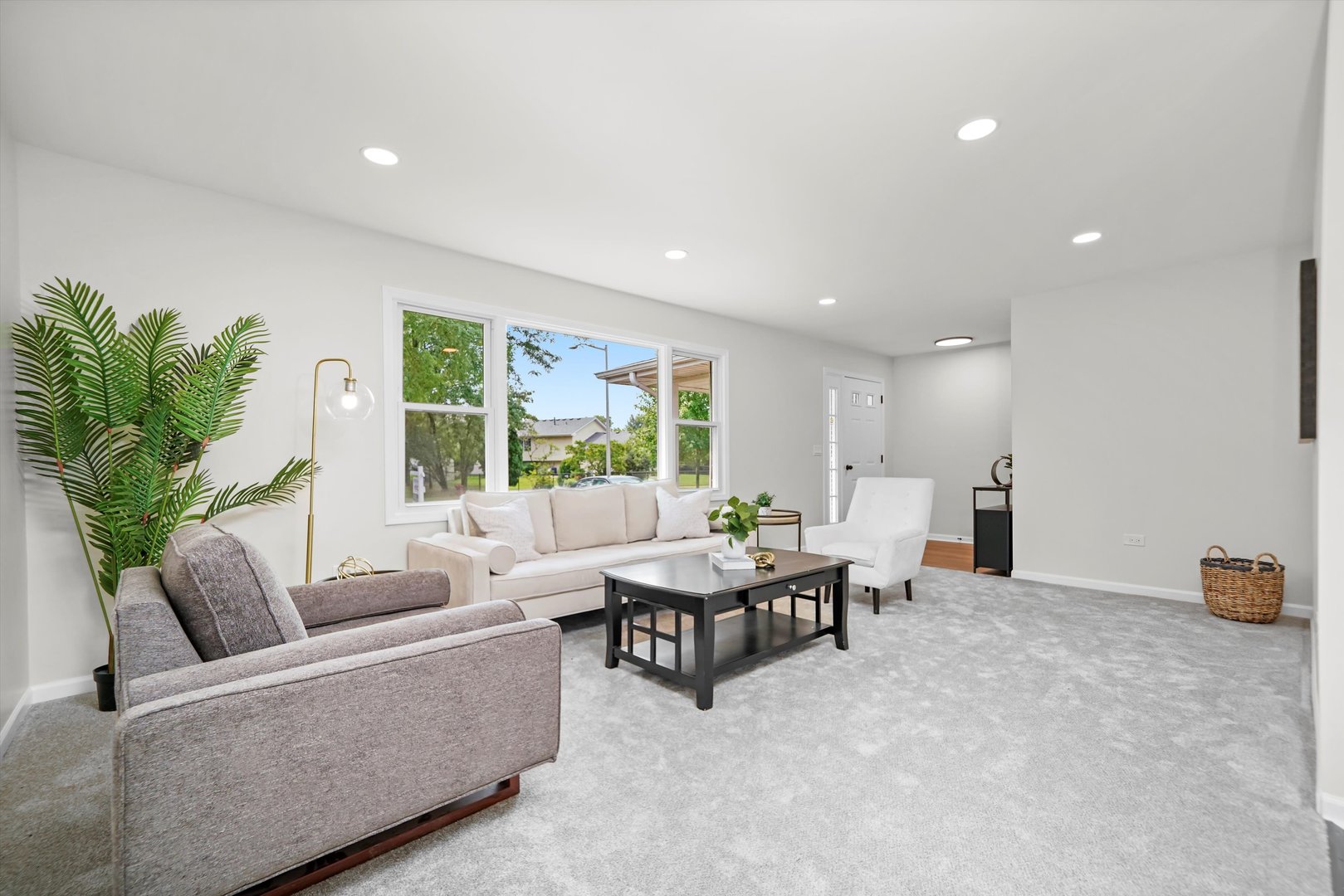 1668 Hidden Valley Drive Bolingbrook, IL 60490 - Photo 7 of 43 a living room with furniture and a large window