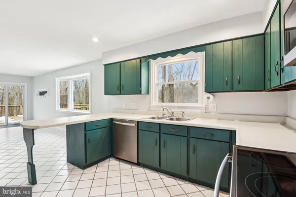 a kitchen with a sink and a window
