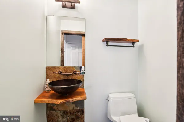 a bathroom with a toilet and a sink