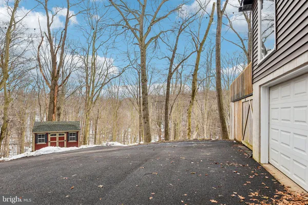 a view of a house with a snow in the yard
