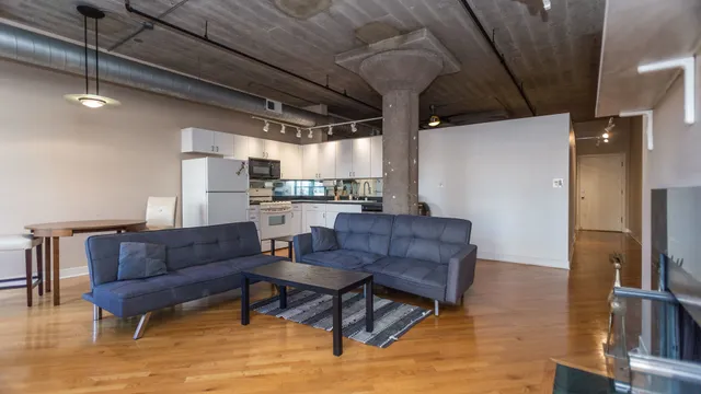 a living room with furniture and a rug