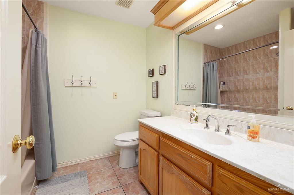23725 North Val Verde Road Edinburg, TX 78542 - Photo 23 of 36 a bathroom with a sink a toilet and shower