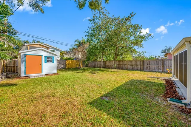 a view of a backyard with a small pool