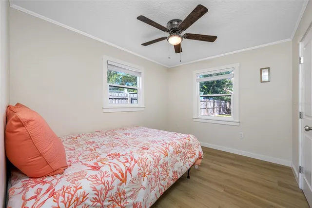 a bedroom with a large bed and a window