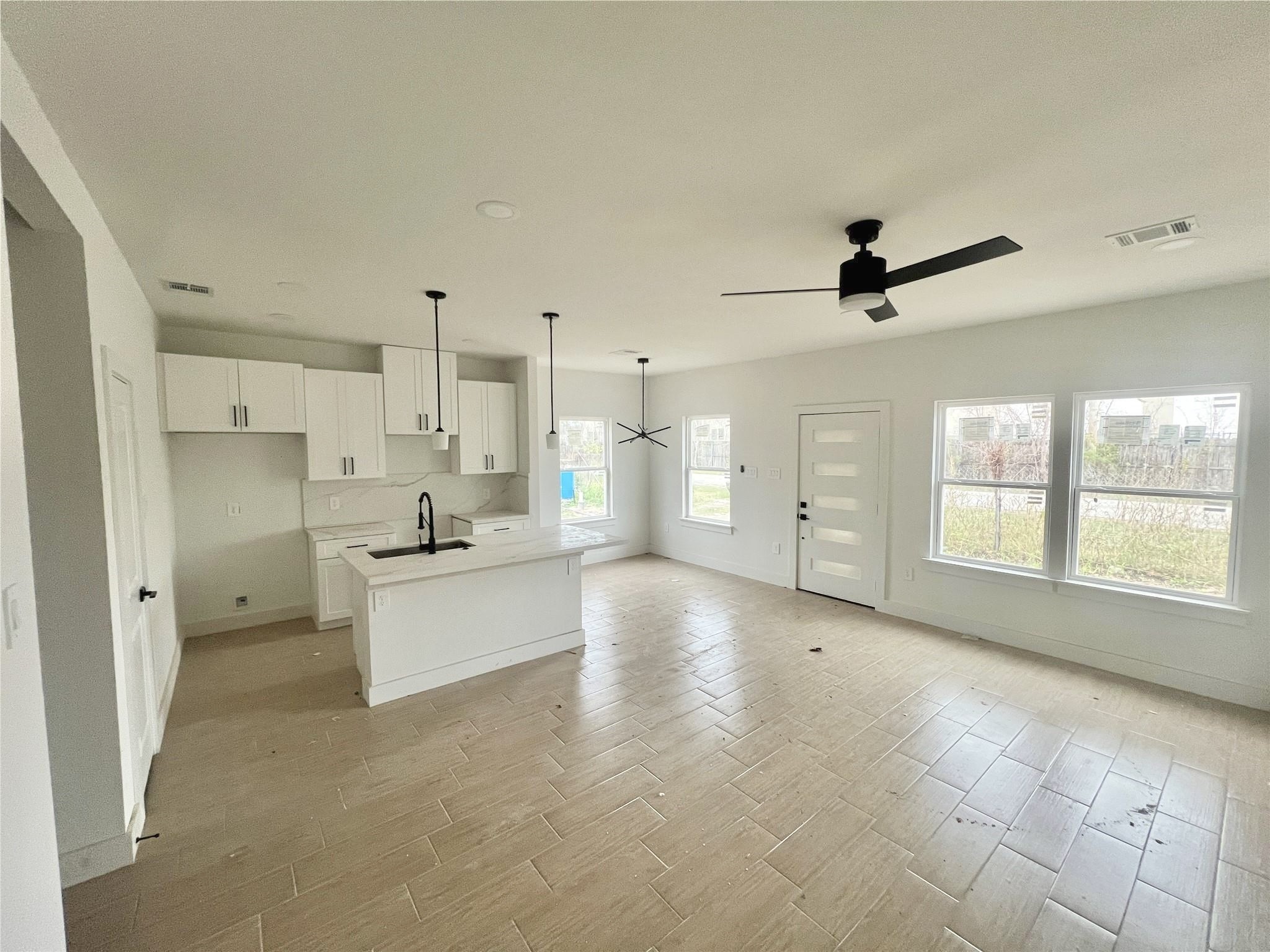 5710 Delmack Street, Unit A Houston, TX 77032 - Photo 6 of 23 Living Room, Kitchen, & Dinning