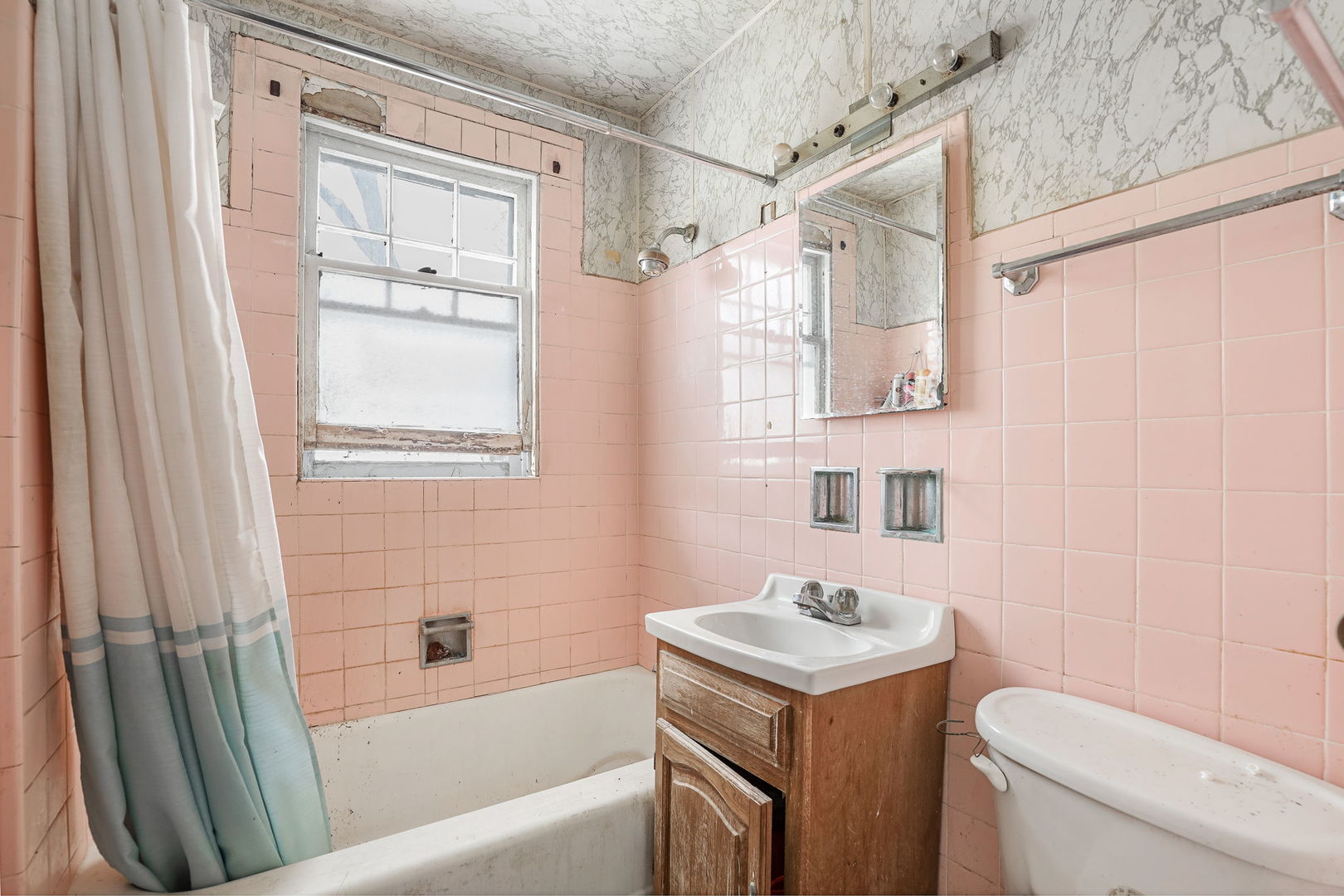1815 Cleveland Street Evanston, IL 60202 - Photo 12 of 22 a bathroom with a sink a toilet and shower