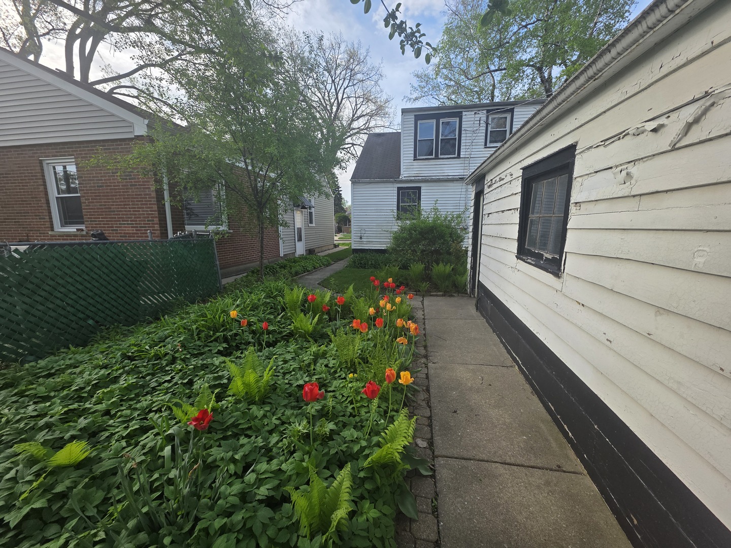 1815 Cleveland Street Evanston, IL 60202 - Photo 19 of 22 a house with flowers in front of it