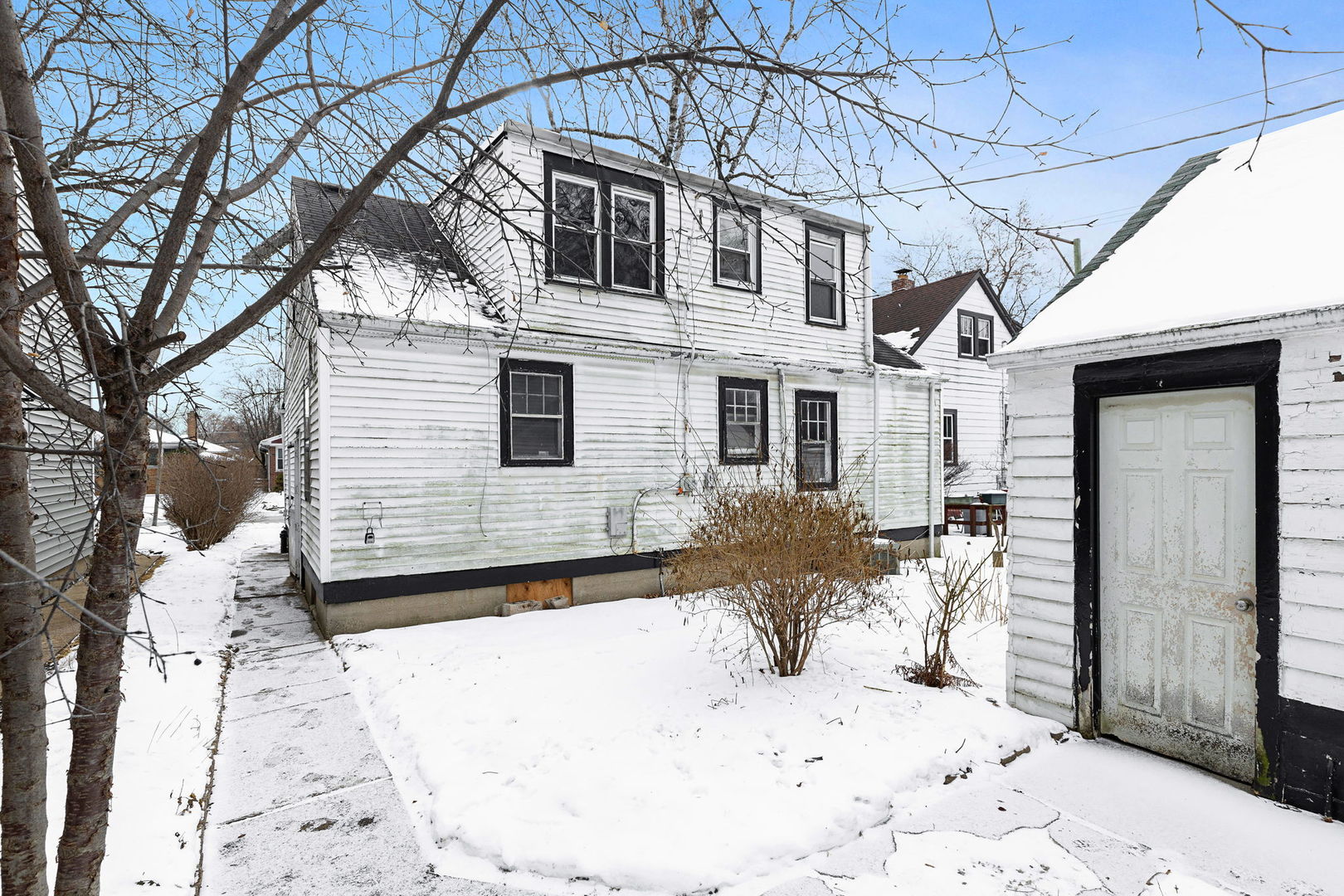 1815 Cleveland Street Evanston, IL 60202 - Photo 9 of 22 a view of a house with a snow in the yard