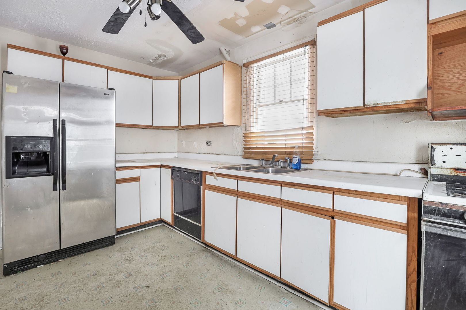 1815 Cleveland Street Evanston, IL 60202 - Photo 10 of 22 a kitchen with stainless steel appliances granite countertop a sink a refrigerator and cabinets