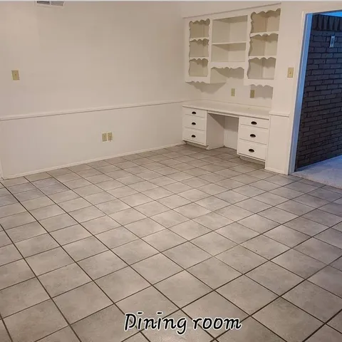 a view of white cabinets and utility room