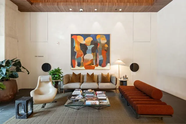 a living room with furniture and flowers