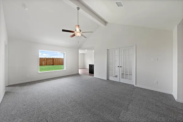a view of an empty room with a window