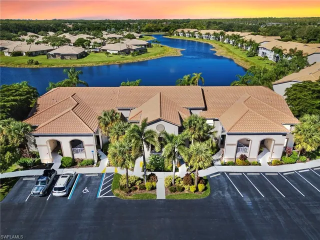 an aerial view of a house with yard swimming pool and outdoor seating