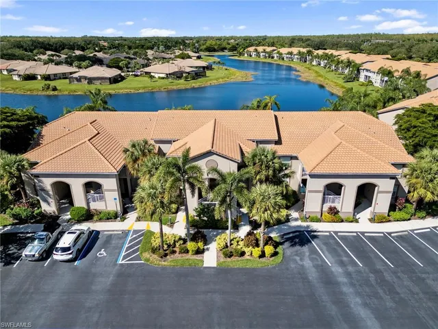 an aerial view of a house with a yard basket ball court and outdoor seating