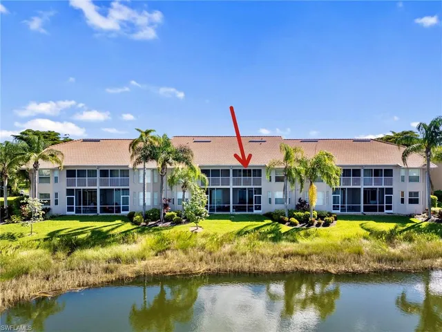 a view of a house with swimming pool and a yard