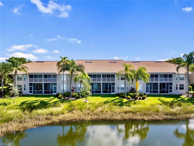 a view of a house with swimming pool and a yard