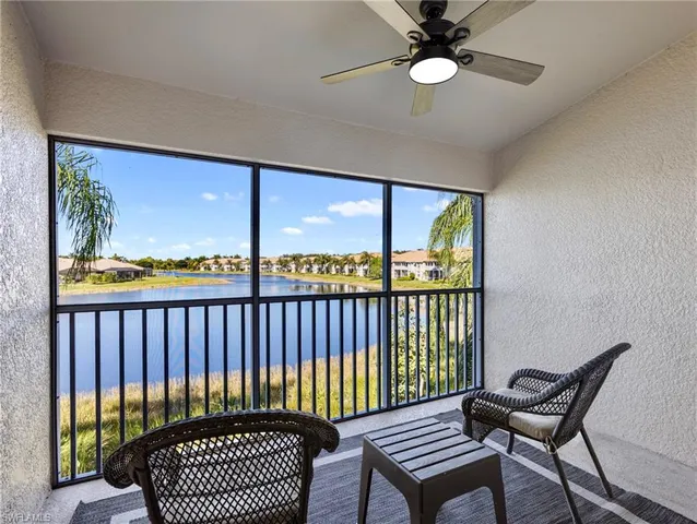 a view of a balcony with furniture