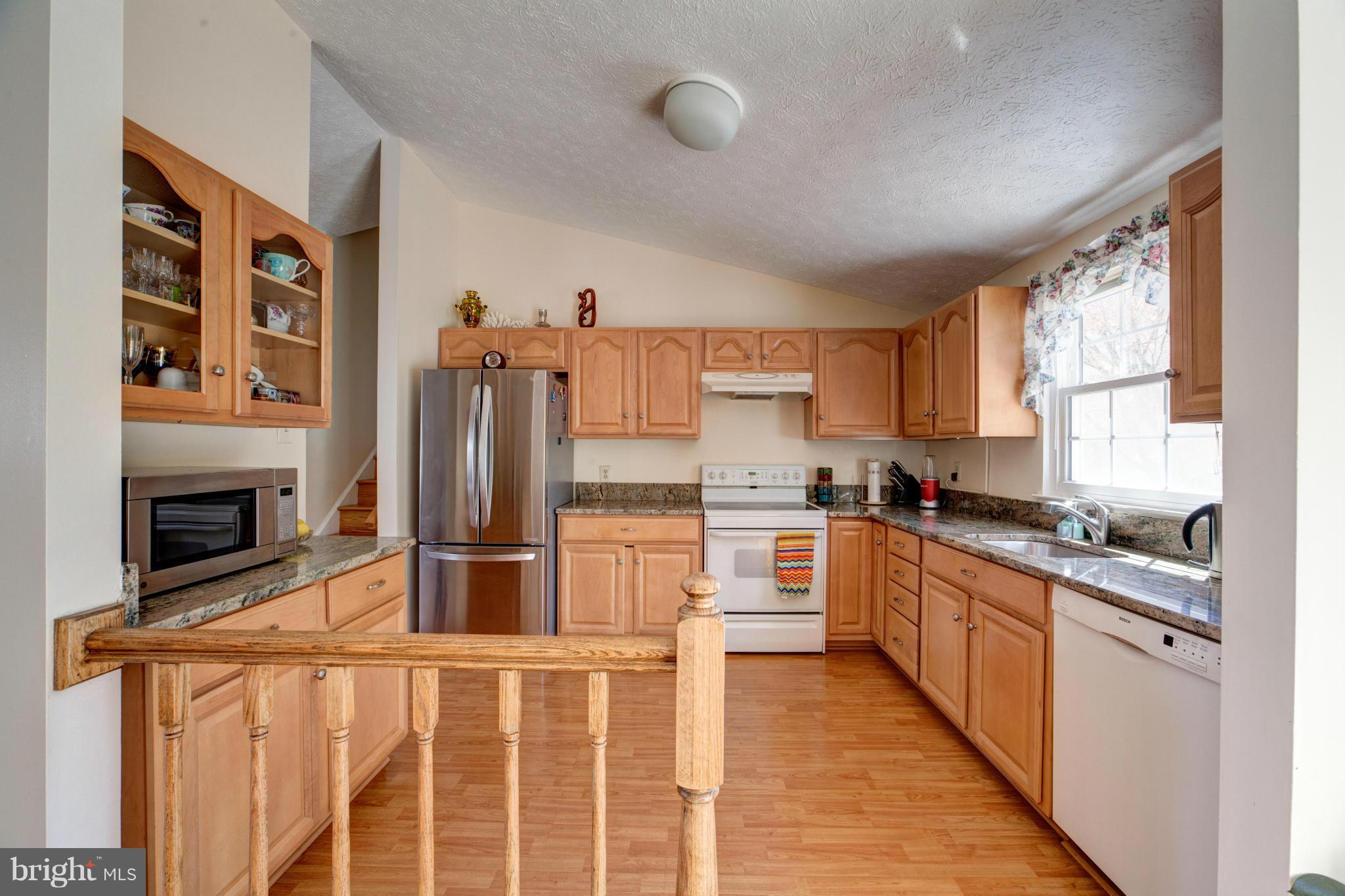 3116 Beethoven Way Silver Spring, MD 20904 - Photo 11 of 30 a kitchen with stainless steel appliances a stove sink and cabinets
