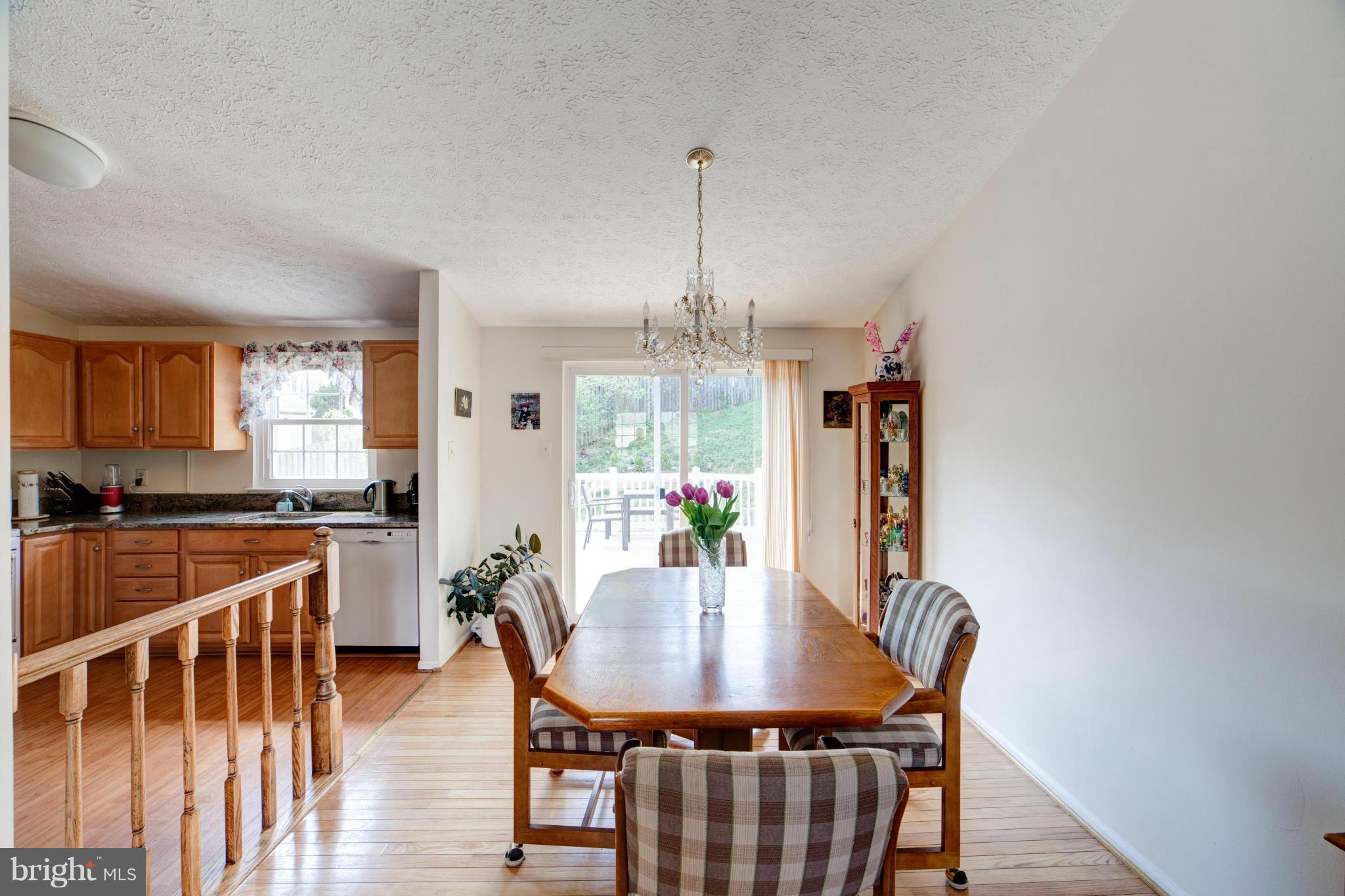 3116 Beethoven Way Silver Spring, MD 20904 - Photo 13 of 30 a view of a dining room with furniture window and wooden floor