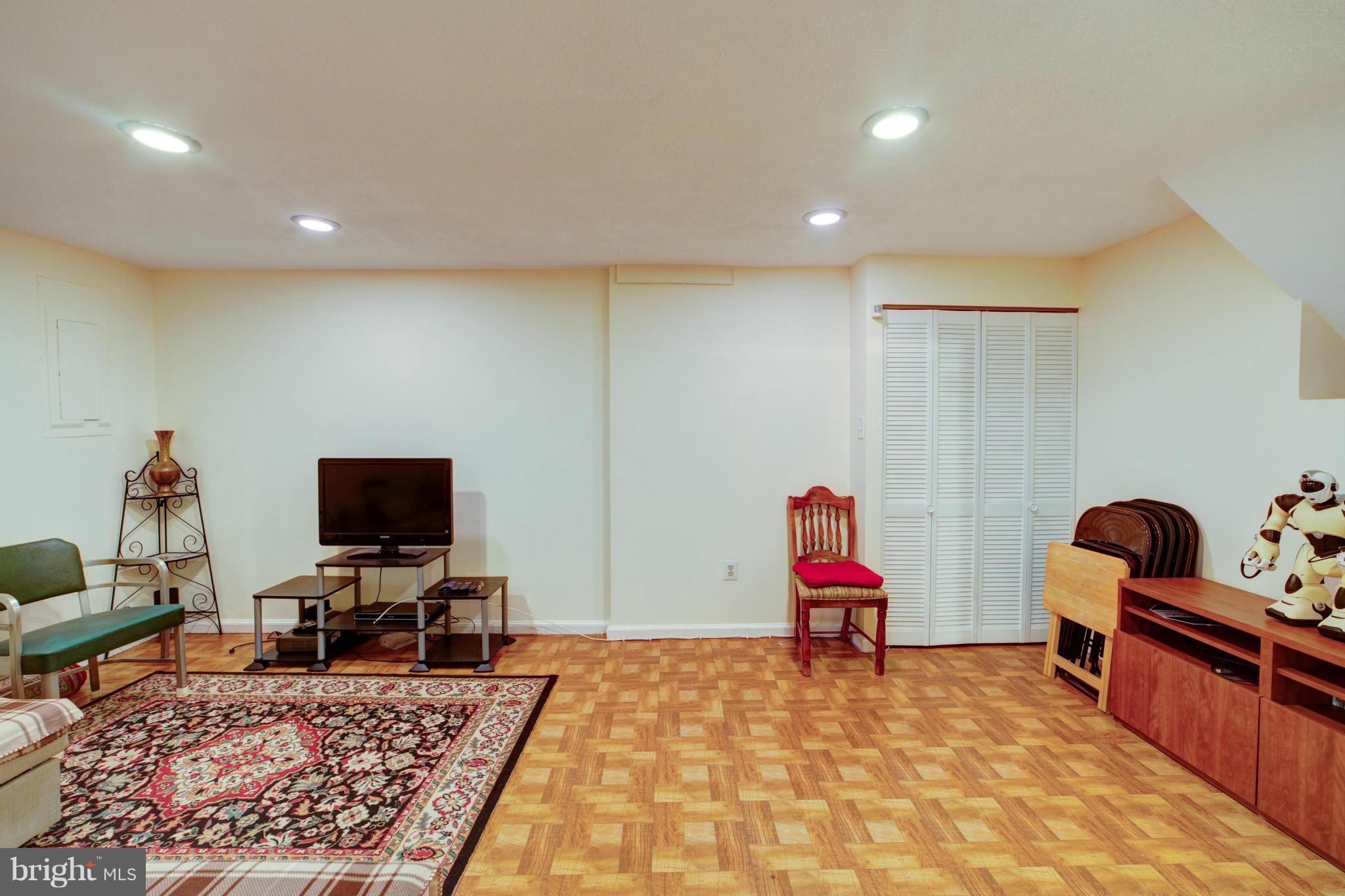 3116 Beethoven Way Silver Spring, MD 20904 - Photo 21 of 30 a living room with furniture flat screen tv and rug