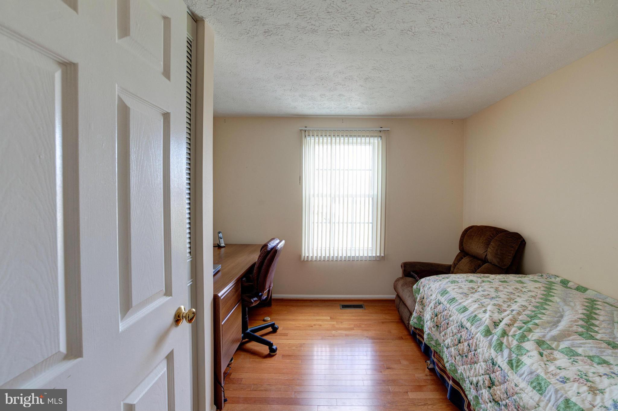 3116 Beethoven Way Silver Spring, MD 20904 - Photo 22 of 30 a bedroom with bed and a window