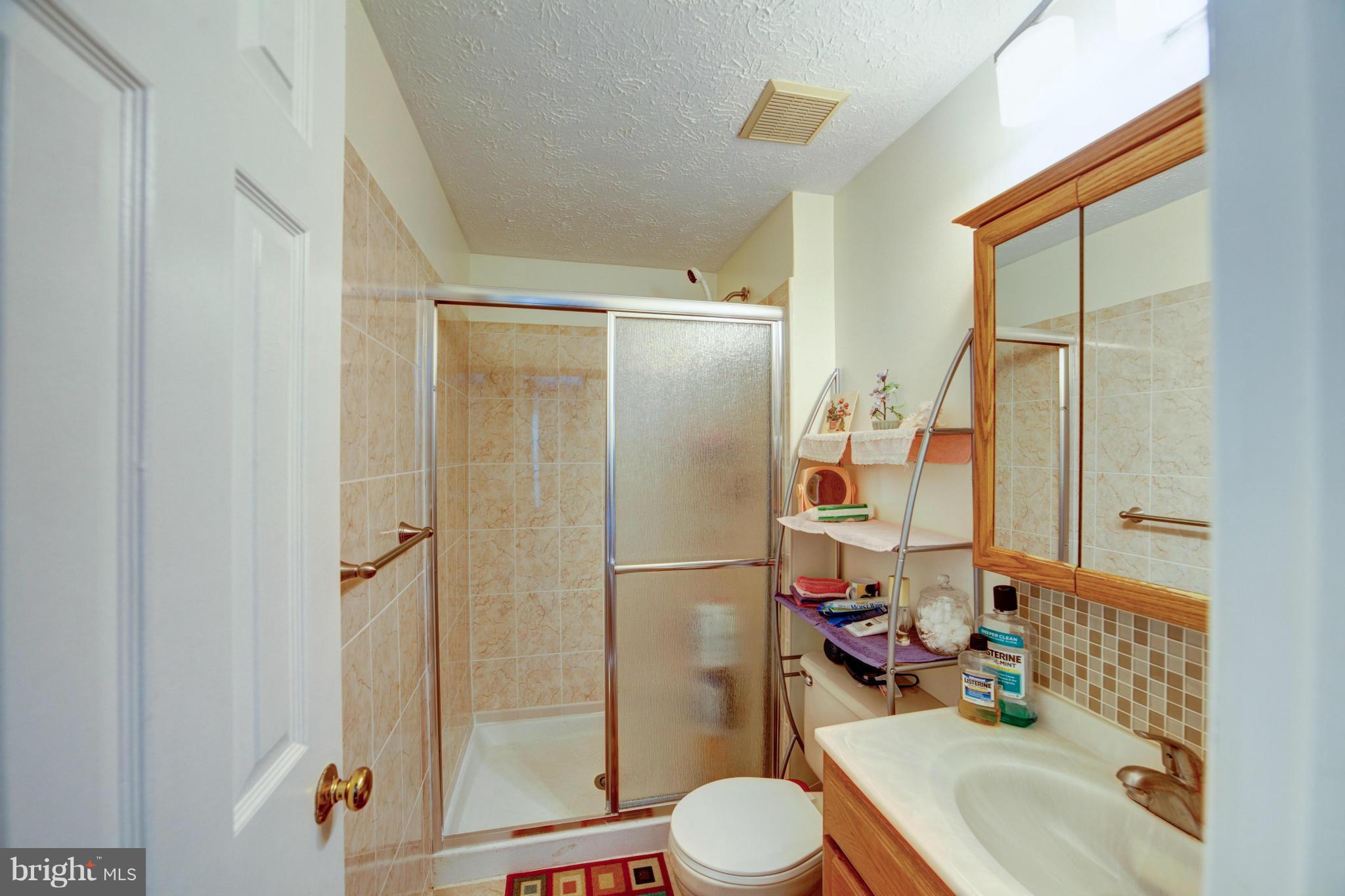 3116 Beethoven Way Silver Spring, MD 20904 - Photo 26 of 30 a bathroom with a sink toilet and shower