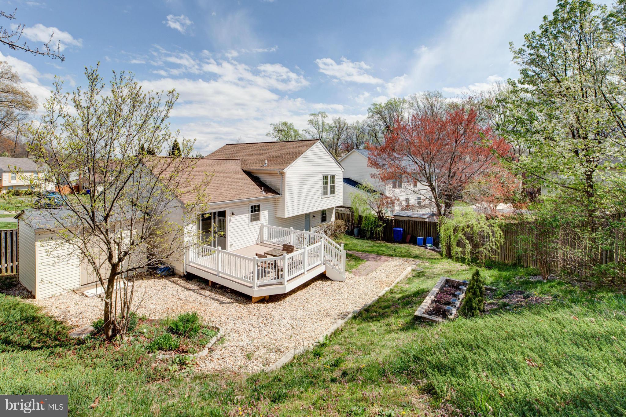 3116 Beethoven Way Silver Spring, MD 20904 - Photo 5 of 30 a front view of a house with a yard and fountain