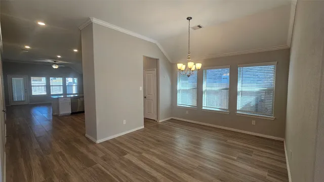 a view of a livingroom with a ceiling fan and window