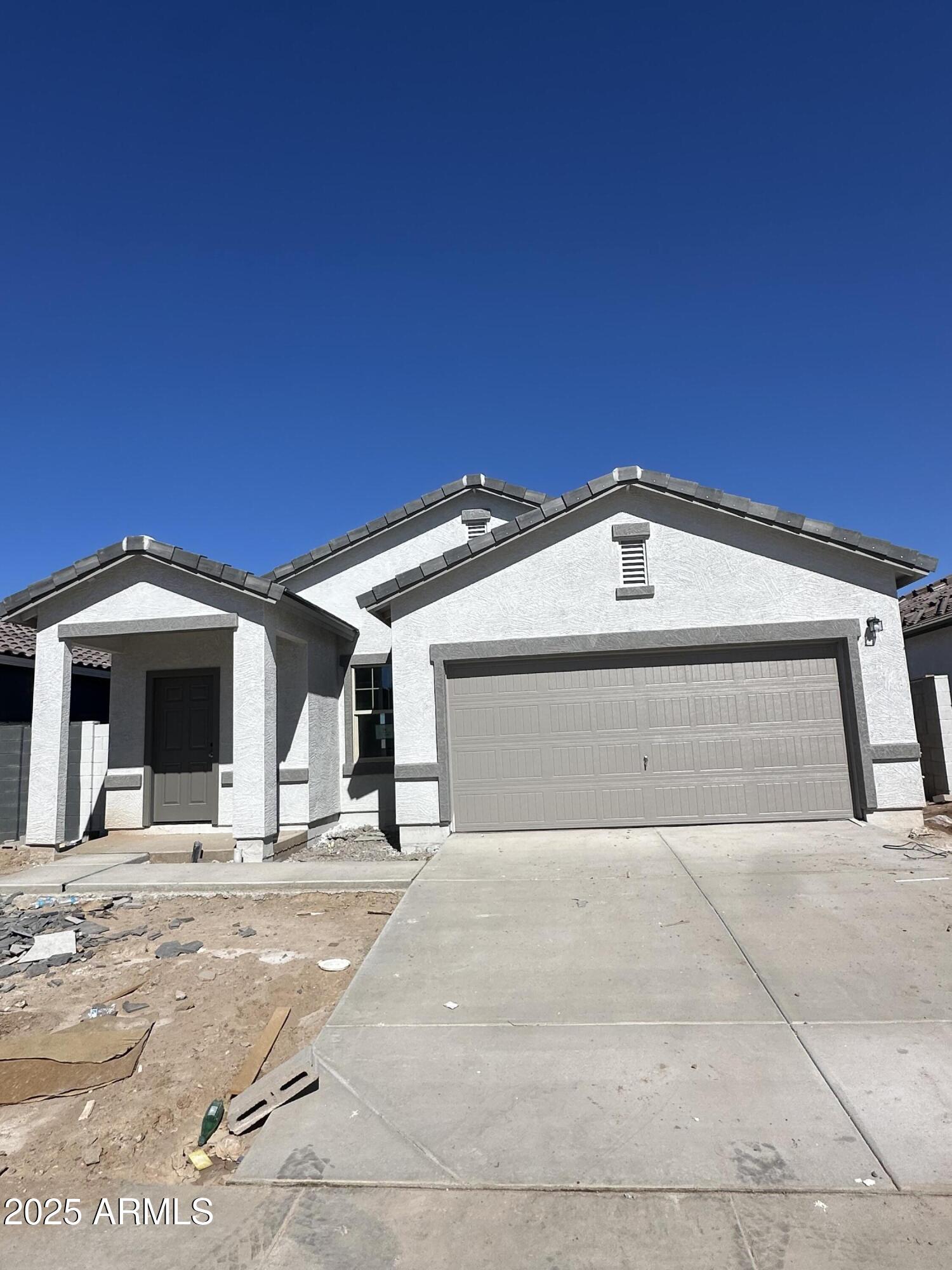 2056 Night Rider Road San Tan Valley, AZ 85140 - Photo 2 of 12 a view of garage with of a house