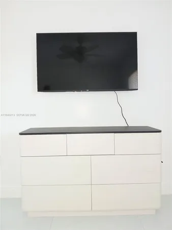 a bathroom with a toilet and a bathtub