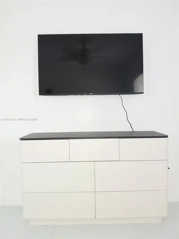 a bathroom with a toilet and a bathtub