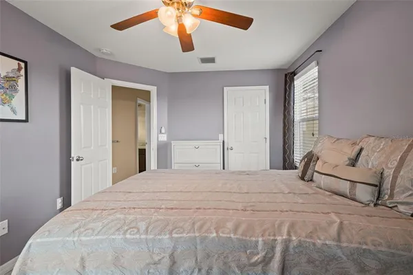 a bed room with a bed and a baby crib