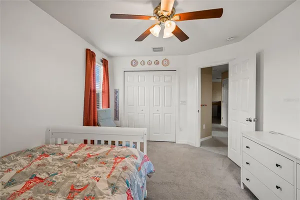 a room with stainless steel appliances granite countertop a stove and a refrigerator