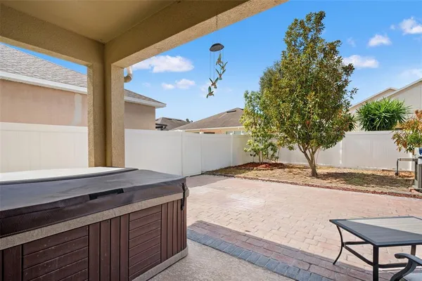 an aerial view of a house with a swimming pool