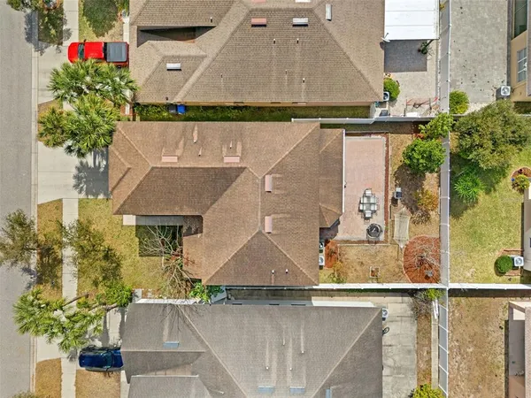a view of a patio with couches and a fire pit