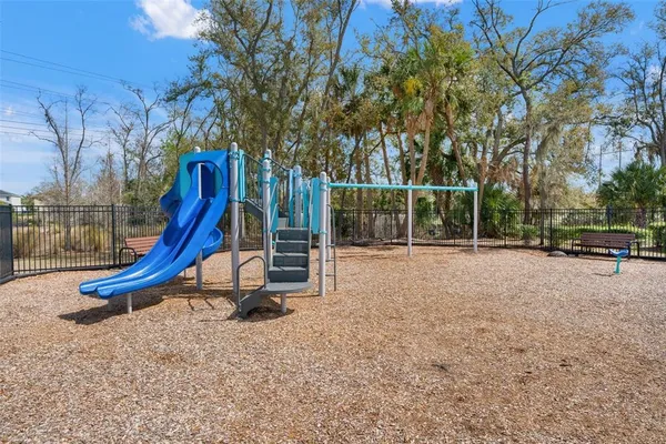 a view of a patio with table and chairs potted plants with wooden fence