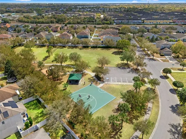 an aerial view of residential houses with outdoor space