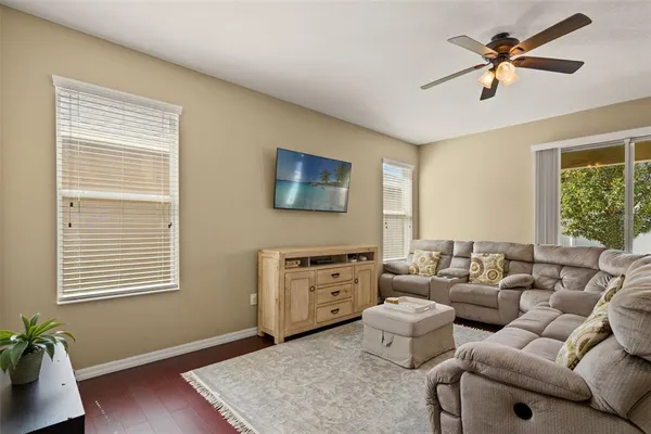 a kitchen with stainless steel appliances granite countertop a stove top oven a sink dishwasher a refrigerator and cabinets with wooden floor