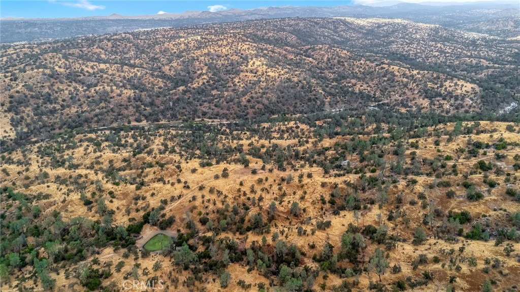 37749 Misty Ridge Road Raymond, CA 93653 - Photo 21 of 23 an aerial view of house with yard and mountain view in back
