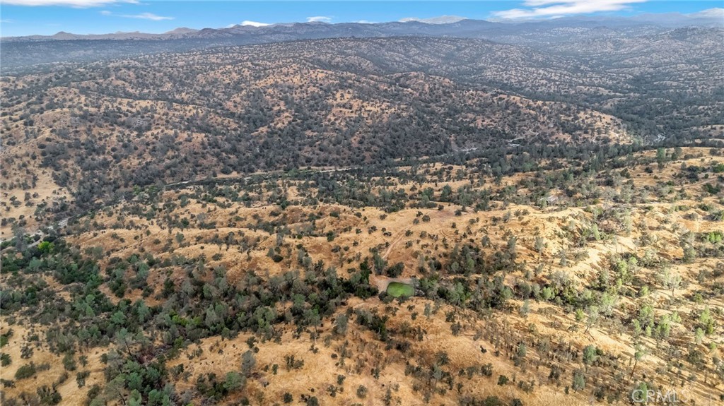 37749 Misty Ridge Road Raymond, CA 93653 - Photo 10 of 23 a view of a field with mountains in the background