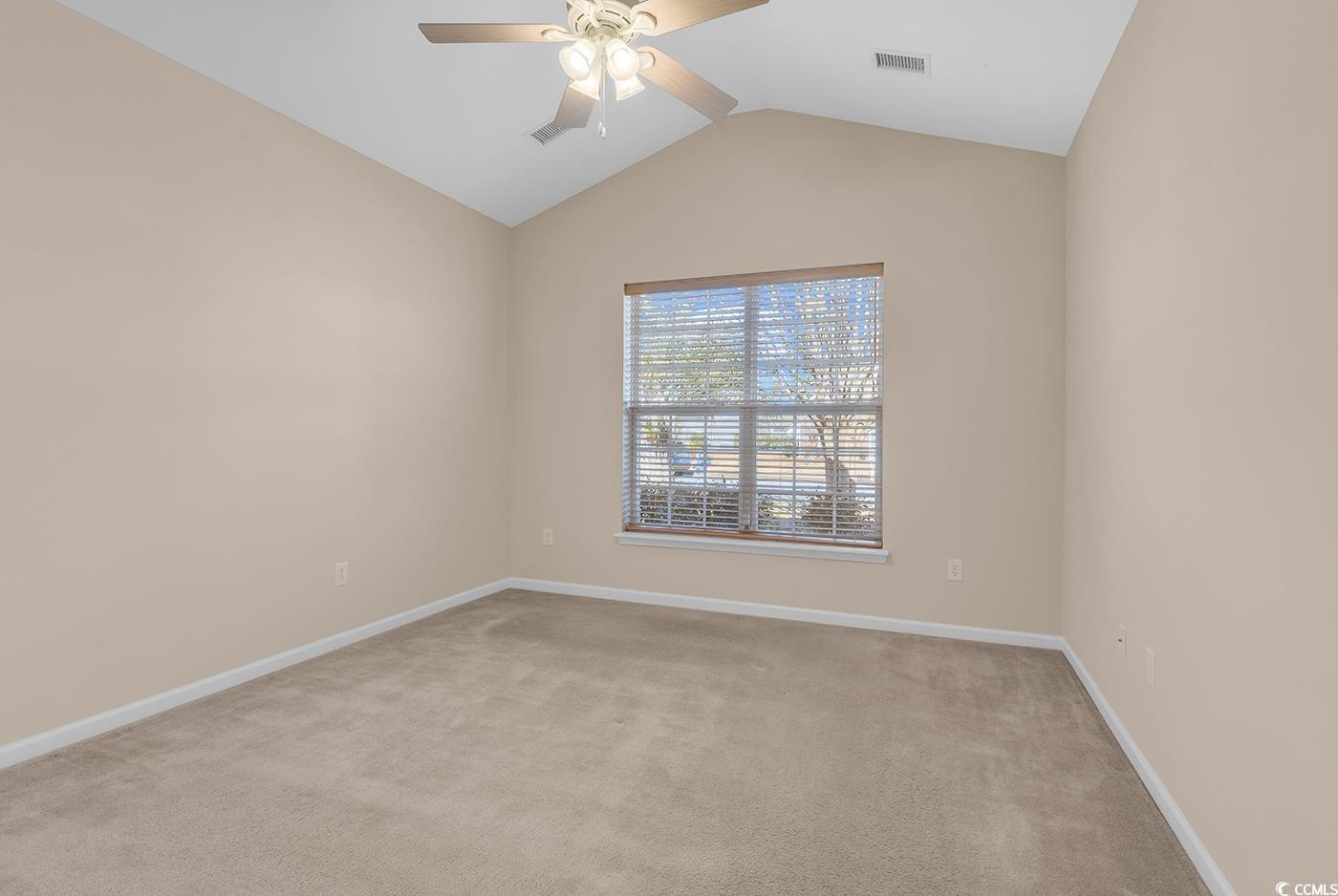 1612 Fairforest Court Conway, SC 29526 - Photo 26 of 40 Spare room with lofted ceiling, light colored carpet, and ceiling fan